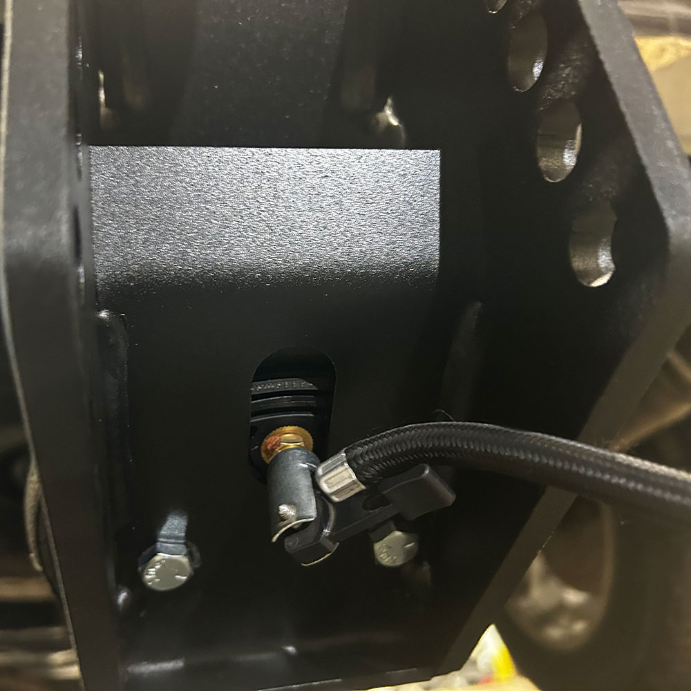 Filling up air spring using an air compressor on the valve stem