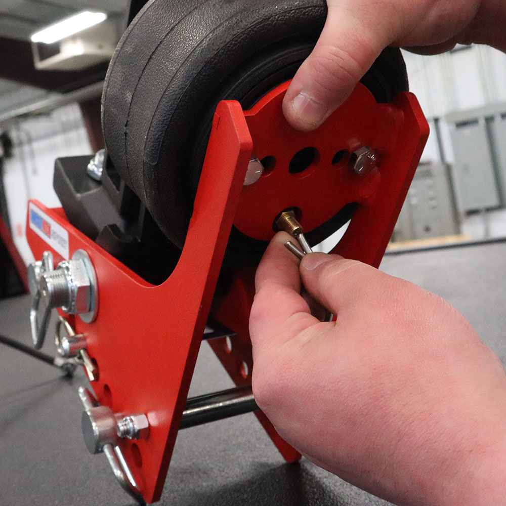 Releasing air pressure with cotter pin and pressing down on paddle