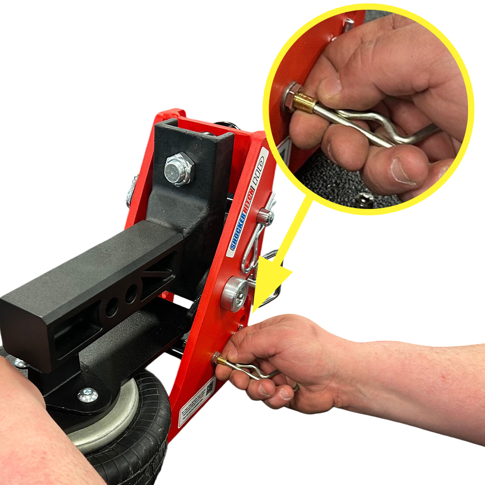 Releasing air pressure with cotter pin clip and pressing down on paddle simultaneously