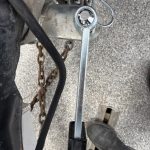 Close-up of the silver Shocker sway arm socket fitted over the hitch-side mini ball with its retaining clip.